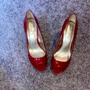 Red peep toe pumps.